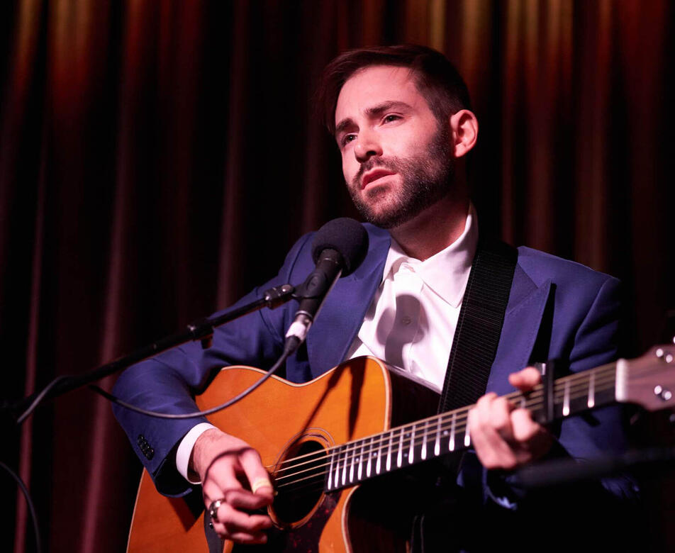 Charles McDonald singing and playing guitar at The Hotel Cafe.