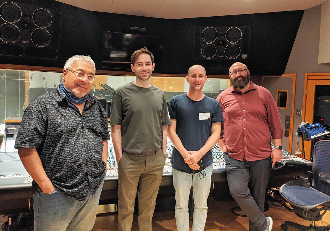Charles McDonald standing next to audio engineers at Capitol Records after a recording session.